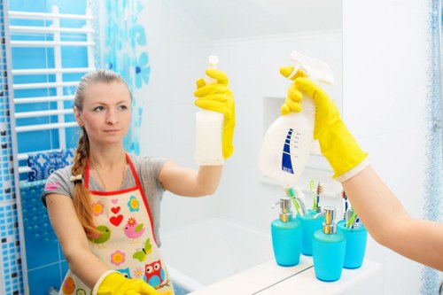 Clean and organized kitchen countertop being cleaned
