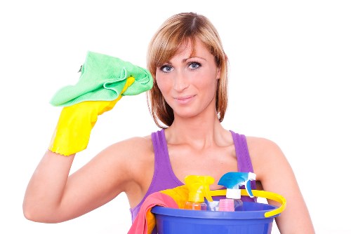 Clean and organized kitchen countertops with cleaning supplies